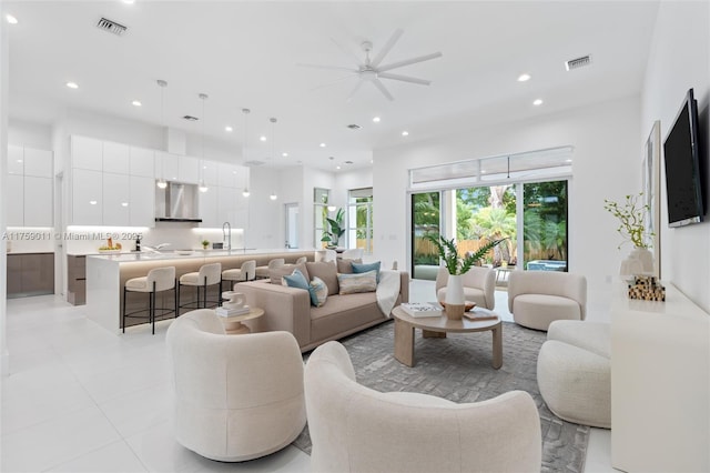 living room with recessed lighting and visible vents