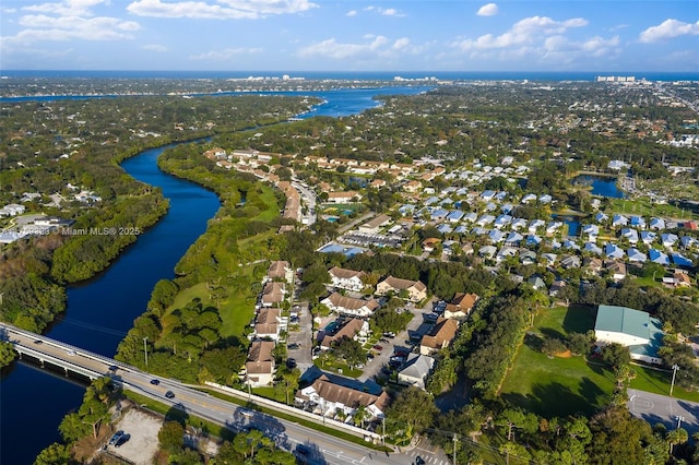 bird's eye view with a residential view and a water view