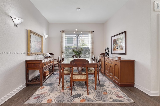 dining room featuring dark wood finished floors and baseboards