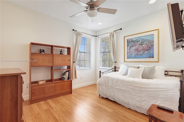 bedroom with recessed lighting, baseboards, light wood-style floors, and ceiling fan