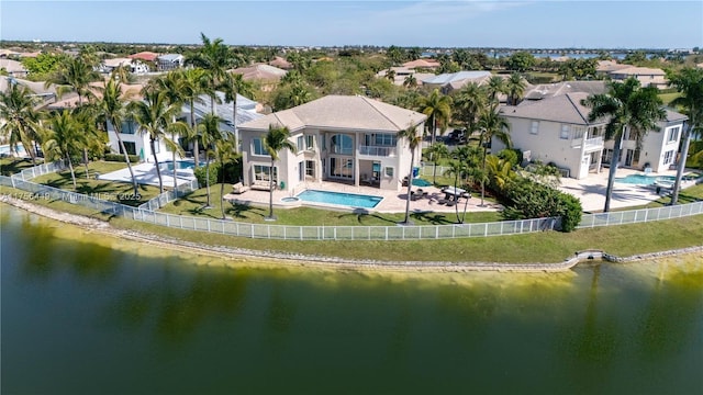 drone / aerial view with a water view and a residential view