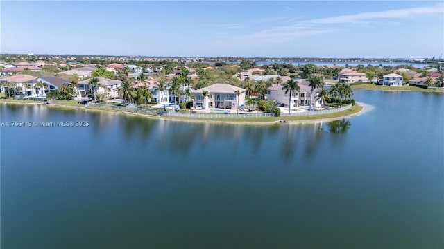 birds eye view of property with a residential view and a water view