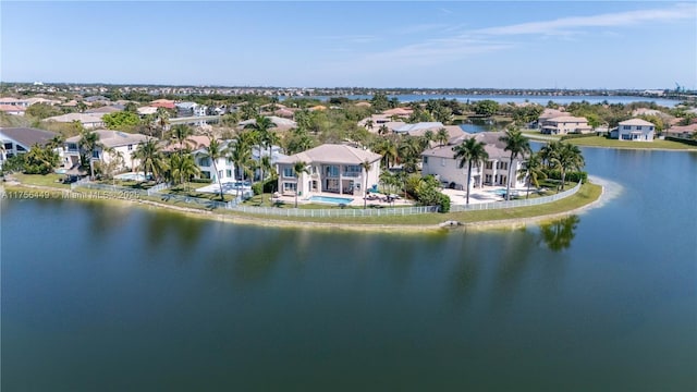 birds eye view of property with a residential view and a water view