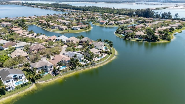 bird's eye view featuring a residential view and a water view