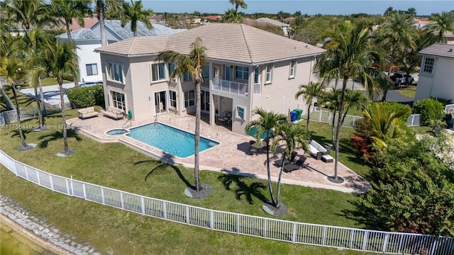 exterior space featuring a balcony, a patio, and a fenced backyard