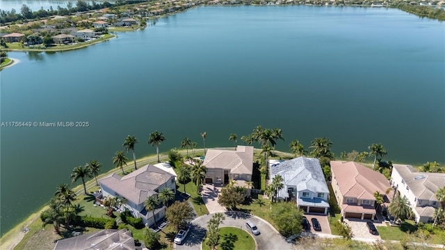 bird's eye view with a residential view and a water view