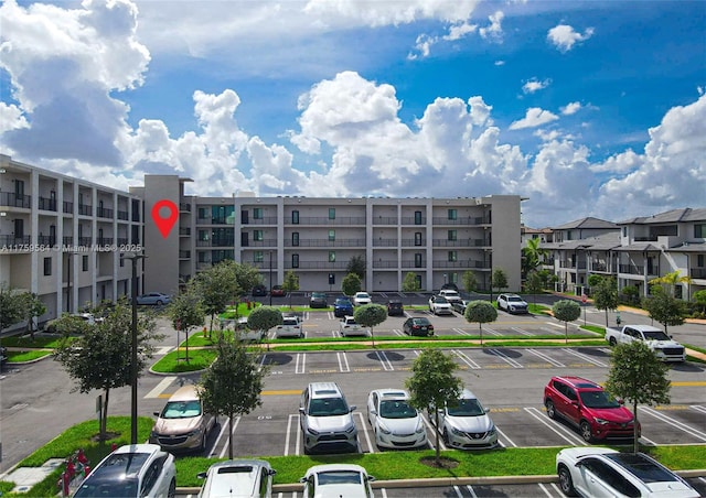 view of property with uncovered parking