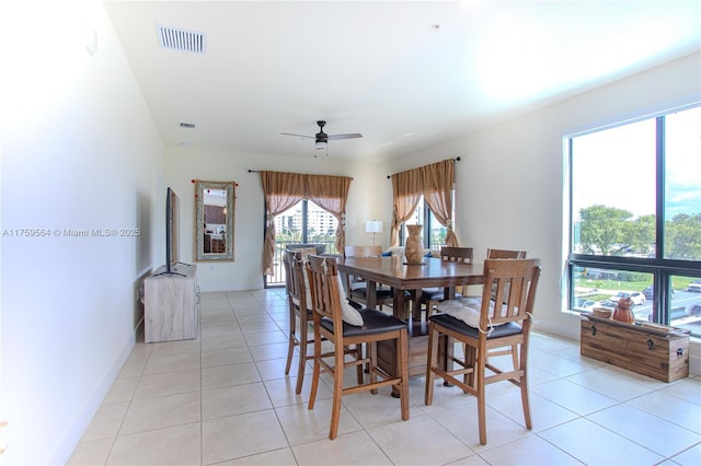 dining area with visible vents, ceiling fan, and light tile patterned floors