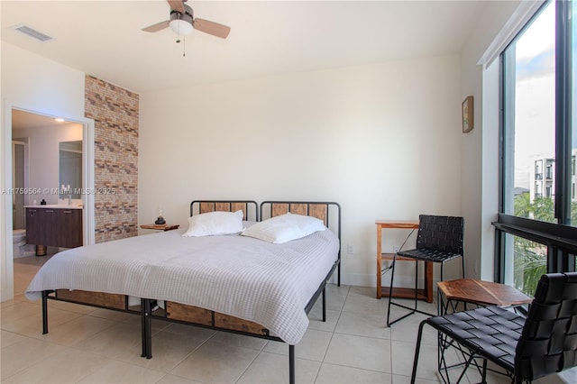 bedroom with light tile patterned floors, ceiling fan, and visible vents