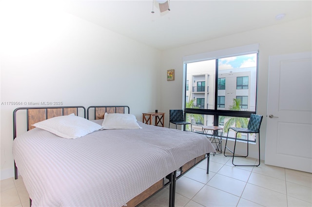 bedroom with light tile patterned floors and a ceiling fan