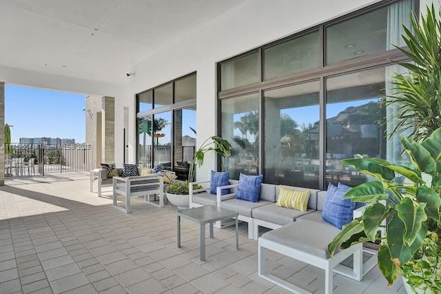 view of patio / terrace with fence and an outdoor living space