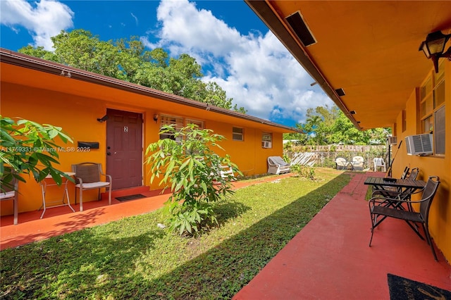 view of yard featuring fence and a patio