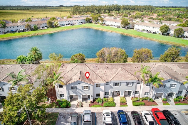aerial view featuring a water view and a residential view