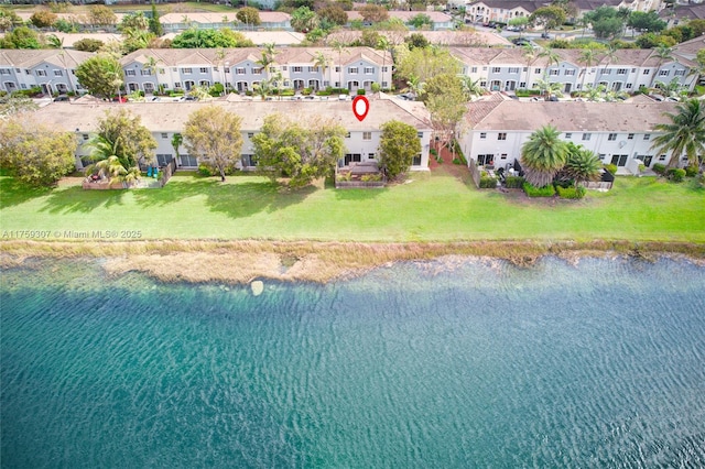 birds eye view of property featuring a residential view and a water view