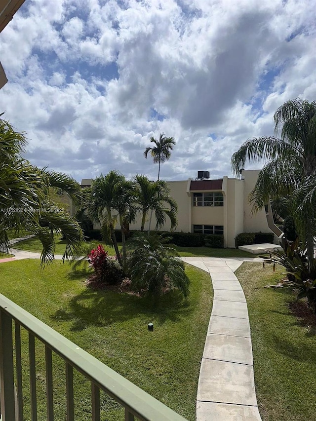 view of home's community featuring a lawn