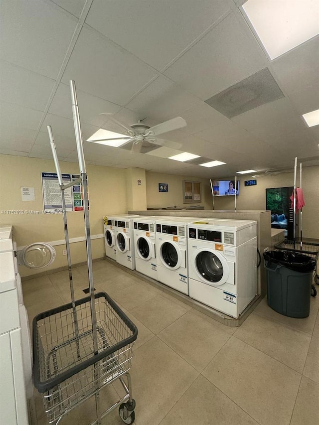 shared laundry area featuring light tile patterned floors, separate washer and dryer, and a ceiling fan