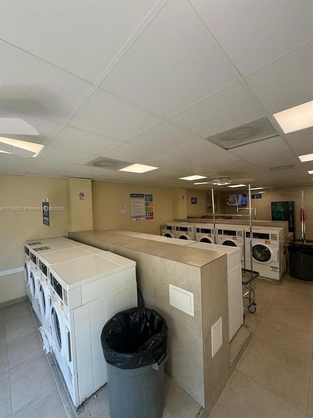 shared laundry area featuring stacked washer and dryer and washing machine and dryer