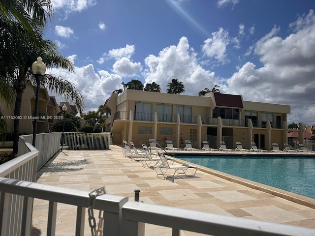 community pool featuring a patio area