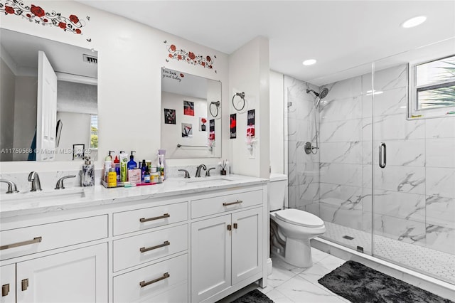 bathroom featuring a wealth of natural light, marble finish floor, a sink, and a marble finish shower