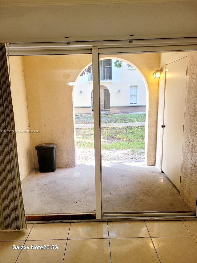 entryway with tile patterned floors