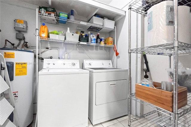 washroom with laundry area, water heater, independent washer and dryer, and light tile patterned floors