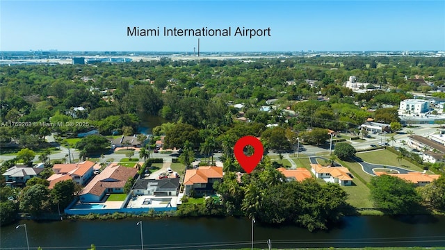 birds eye view of property featuring a water view and a residential view