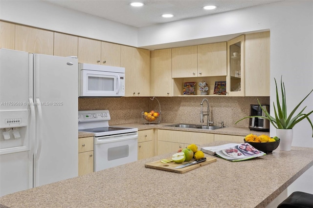 7801 SW 9th Ter, Miami, FL 33144 - kitchen with light brown cabinetry, tasteful backsplash, white appliances, and a sink