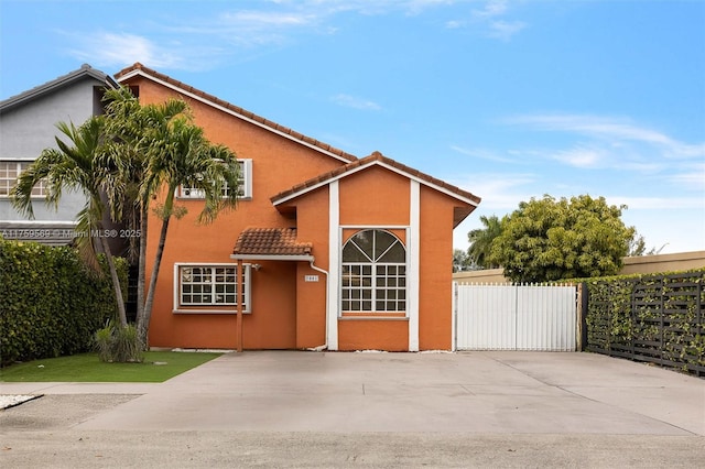 7801 SW 9th Ter, Miami, FL 33144 - view of front of property featuring stucco siding, fence, and a tiled roof