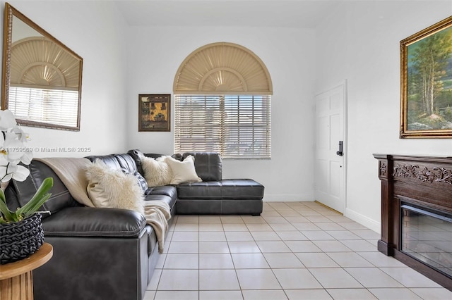 7801 SW 9th Ter, Miami, FL 33144 - living room featuring baseboards and light tile patterned floors