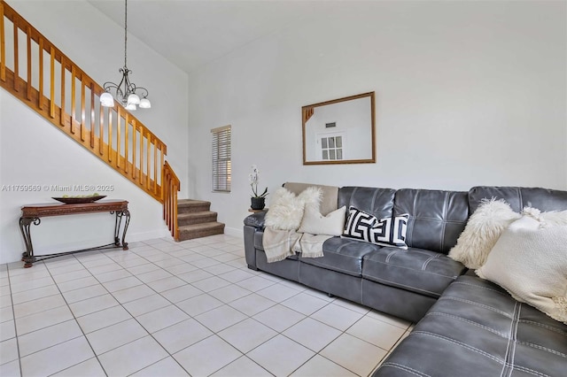 7801 SW 9th Ter, Miami, FL 33144 - tiled living room with a towering ceiling, baseboards, a notable chandelier, and stairs
