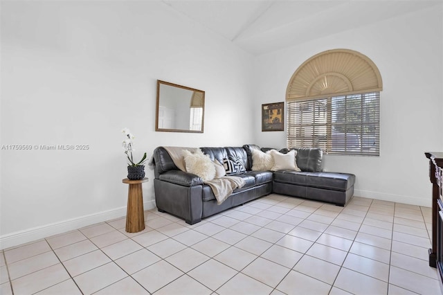 7801 SW 9th Ter, Miami, FL 33144 - living room featuring a wealth of natural light, light tile patterned floors, and vaulted ceiling