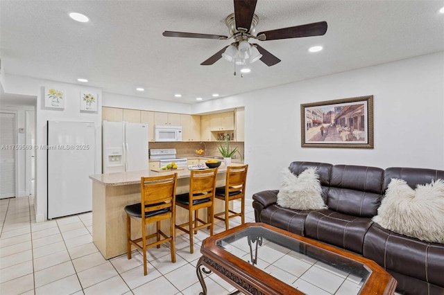 7801 SW 9th Ter, Miami, FL 33144 - living room with light tile patterned flooring, ceiling fan, and recessed lighting