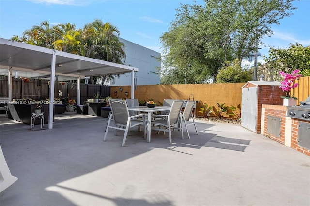 7801 SW 9th Ter, Miami, FL 33144 - view of patio / terrace featuring area for grilling, outdoor dining space, and a fenced backyard