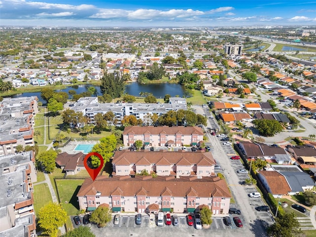 bird's eye view with a residential view and a water view