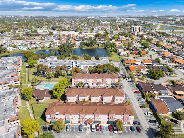 birds eye view of property featuring a water view and a residential view