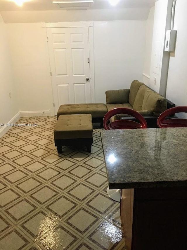 living room featuring baseboards