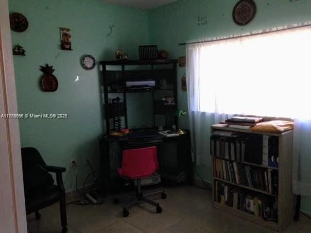 home office featuring tile patterned floors