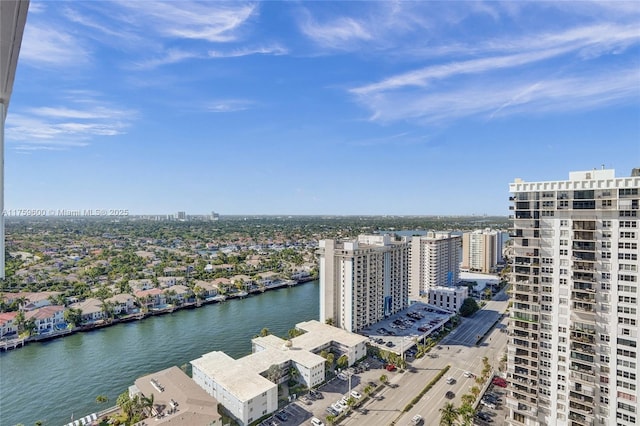 drone / aerial view featuring a water view and a city view