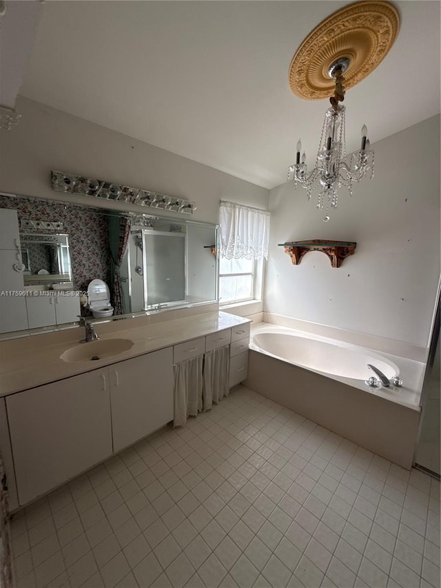 full bath with tile patterned flooring, a notable chandelier, vanity, a shower stall, and a bath