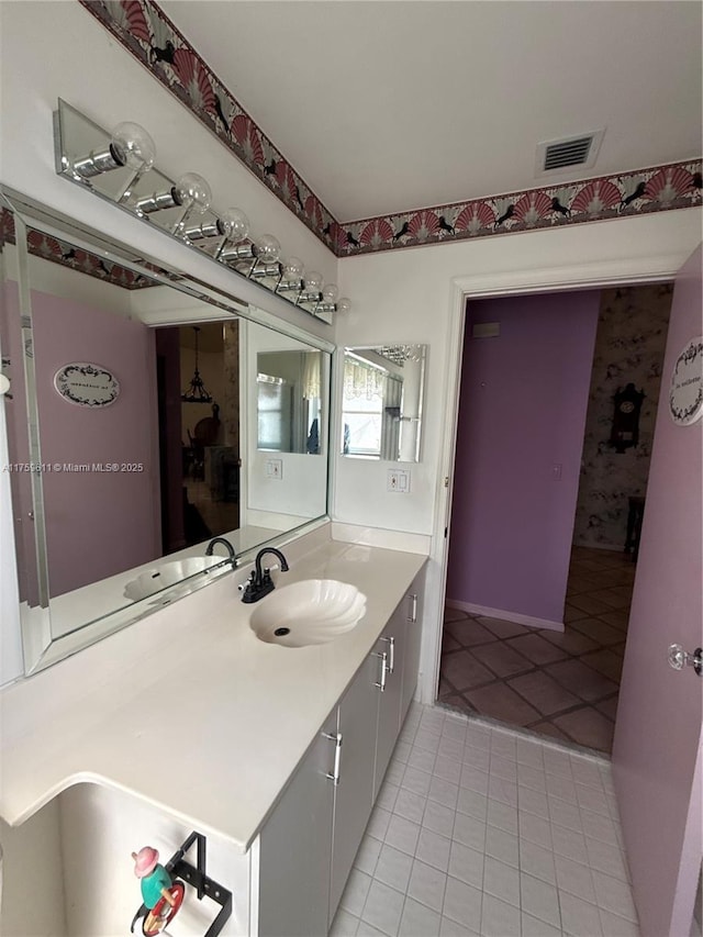 bathroom with vanity, visible vents, and tile patterned floors