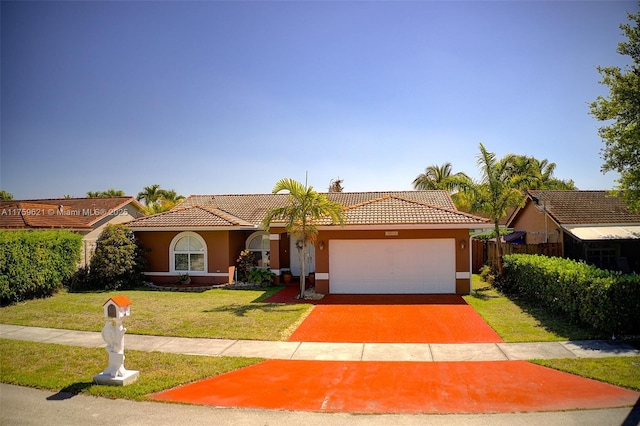 view of front facade featuring a garage, a tiled roof, a front lawn, and stucco siding