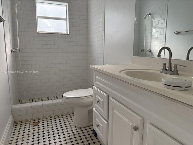 full bath with toilet, a shower stall, and vanity