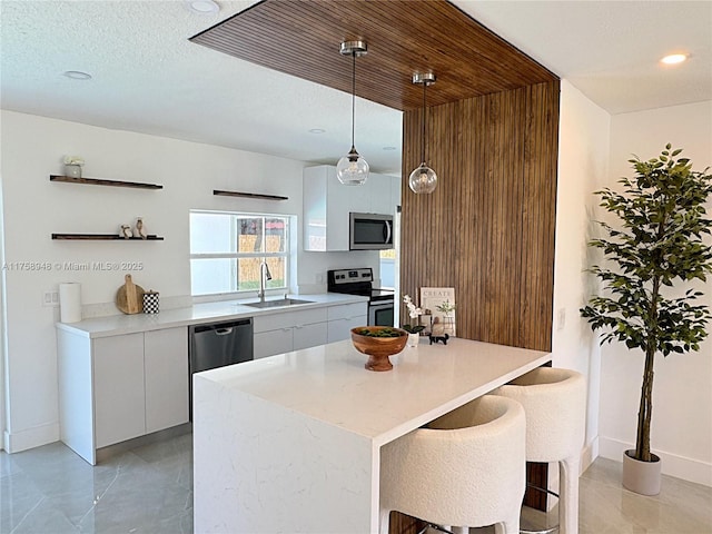 kitchen featuring a sink, stainless steel appliances, white cabinetry, modern cabinets, and open shelves