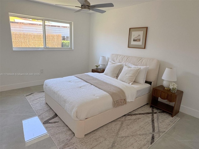 bedroom featuring a ceiling fan and baseboards