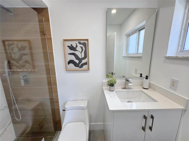 bathroom with vanity, a shower stall, toilet, and recessed lighting