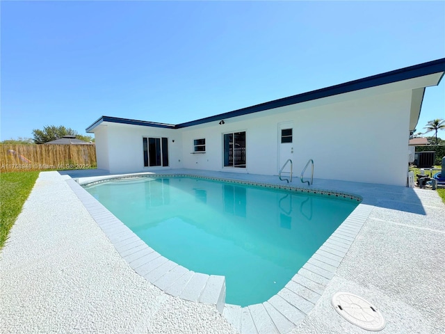 view of pool featuring a fenced in pool, a patio area, and fence