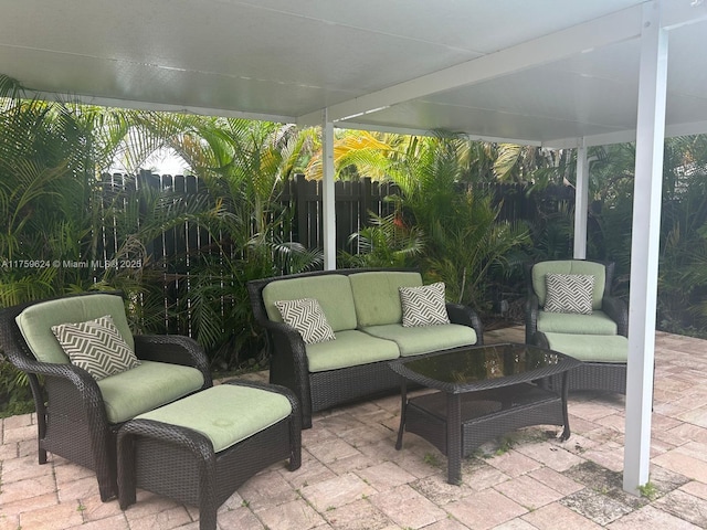 view of patio featuring fence and an outdoor living space