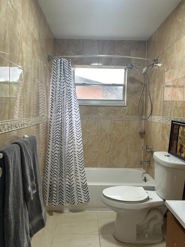 full bath with toilet, tile patterned flooring, shower / bath combination with curtain, and vanity