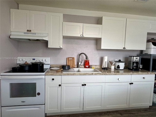 kitchen featuring a sink, white cabinets, under cabinet range hood, and white electric stove