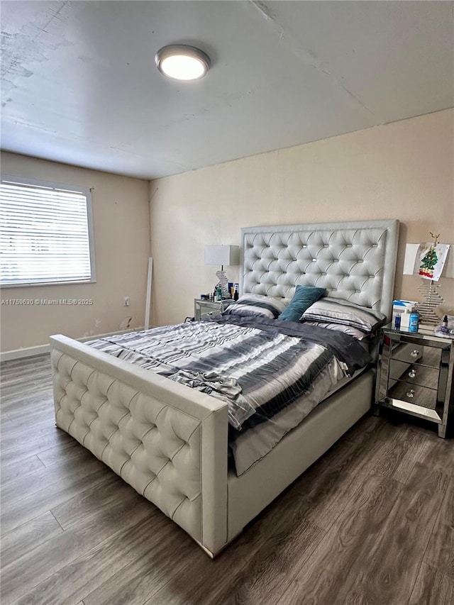 bedroom with wood finished floors